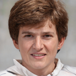 Joyful white adult male with short  brown hair and grey eyes