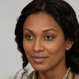 Joyful black young-adult female with medium  brown hair and brown eyes