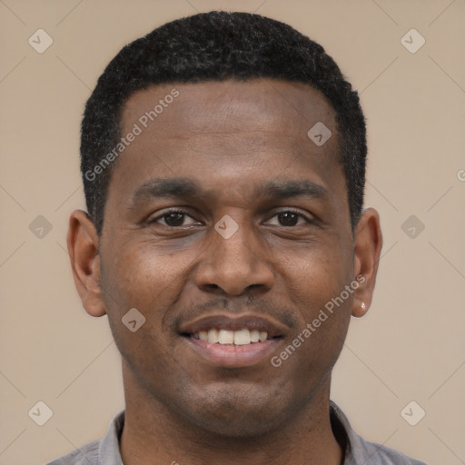 Joyful black young-adult male with short  black hair and brown eyes