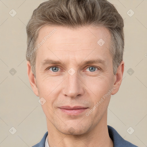 Joyful white adult male with short  brown hair and grey eyes