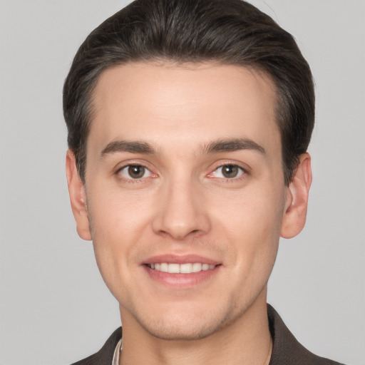 Joyful white young-adult male with short  brown hair and brown eyes