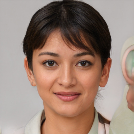 Joyful white young-adult female with medium  brown hair and brown eyes