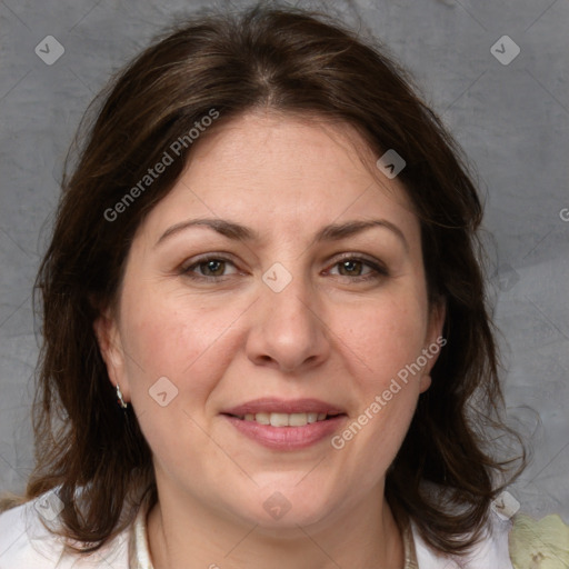 Joyful white adult female with medium  brown hair and grey eyes