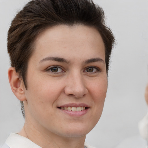 Joyful white young-adult female with short  brown hair and brown eyes