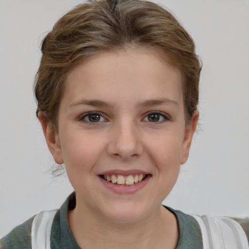 Joyful white child female with short  brown hair and brown eyes