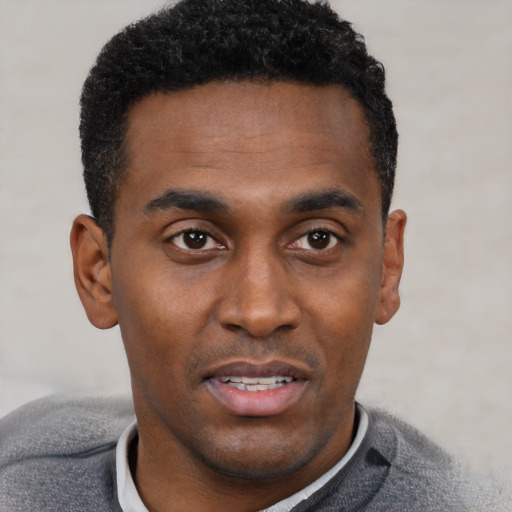 Neutral black young-adult male with short  black hair and brown eyes