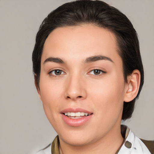 Joyful white young-adult female with medium  brown hair and brown eyes