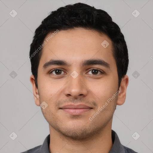 Joyful white young-adult male with short  black hair and brown eyes