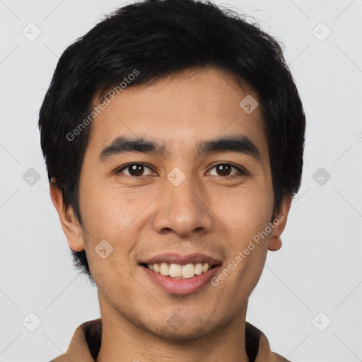 Joyful asian young-adult male with short  black hair and brown eyes