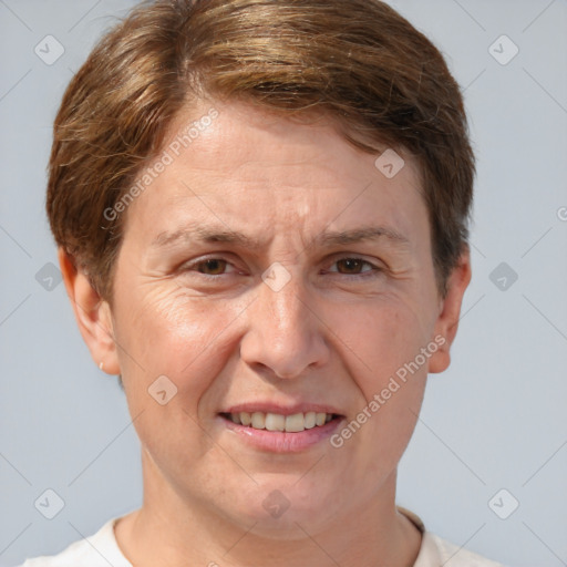 Joyful white adult female with short  brown hair and grey eyes