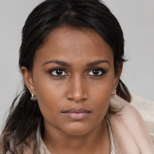 Neutral black young-adult female with long  brown hair and brown eyes