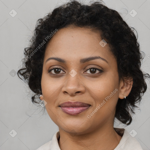 Joyful black young-adult female with medium  brown hair and brown eyes