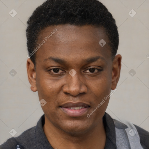 Joyful black young-adult male with short  black hair and brown eyes