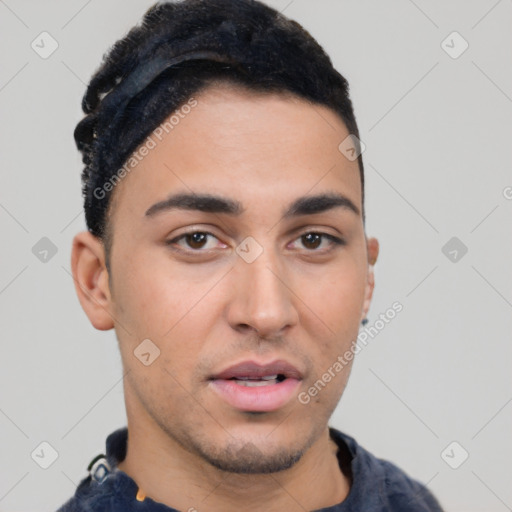 Neutral latino young-adult male with short  black hair and brown eyes