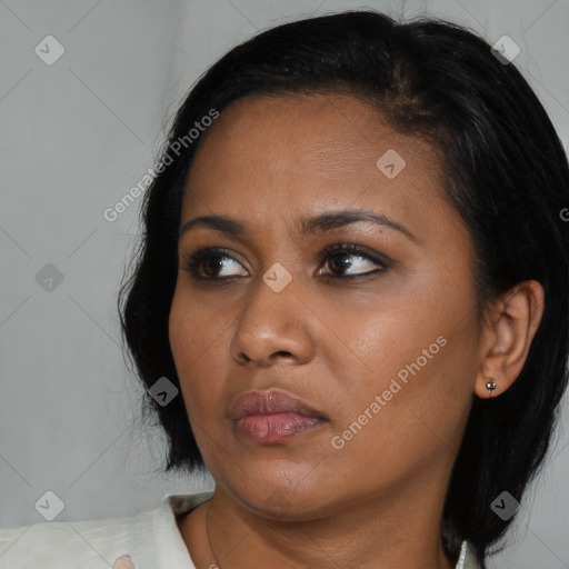 Neutral asian young-adult female with medium  black hair and brown eyes