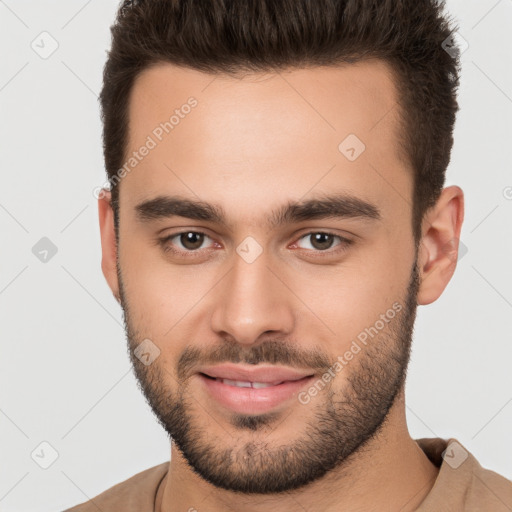 Joyful white young-adult male with short  brown hair and brown eyes