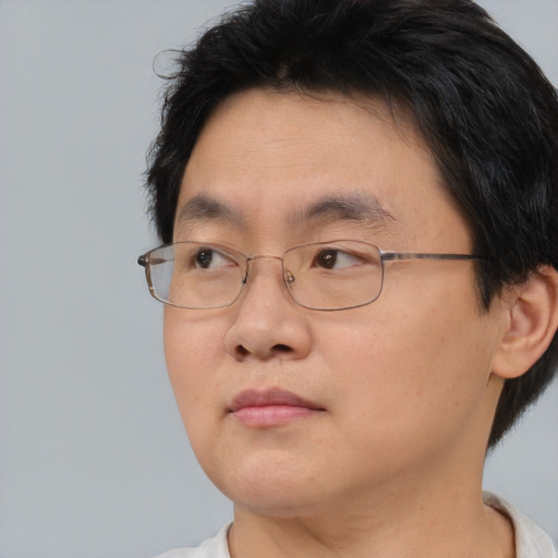 Neutral asian young-adult male with short  brown hair and brown eyes