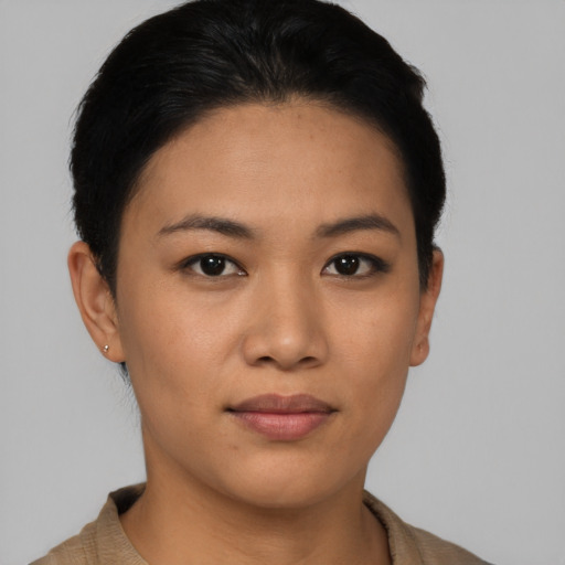 Joyful asian young-adult female with short  black hair and brown eyes