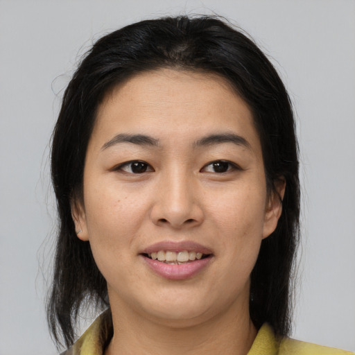 Joyful asian young-adult female with medium  brown hair and brown eyes
