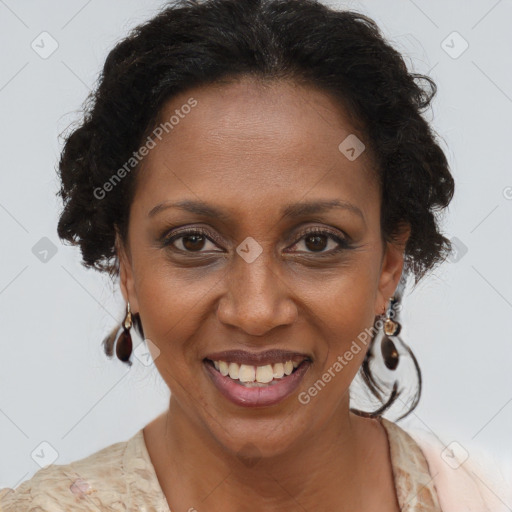 Joyful black adult female with short  brown hair and brown eyes