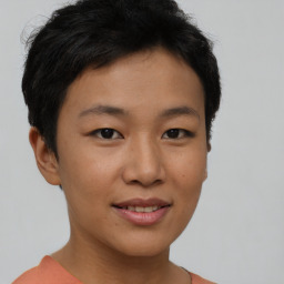 Joyful asian young-adult female with short  brown hair and brown eyes