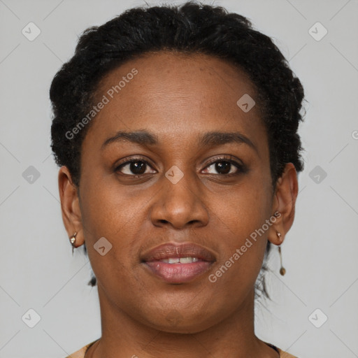 Joyful black young-adult female with short  brown hair and brown eyes