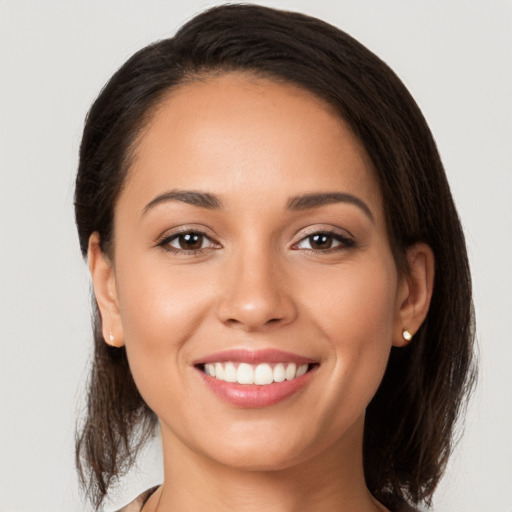 Joyful white young-adult female with medium  brown hair and brown eyes