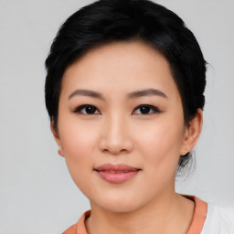 Joyful asian young-adult female with short  black hair and brown eyes