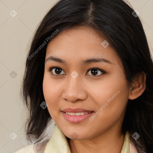 Joyful white young-adult female with long  brown hair and brown eyes