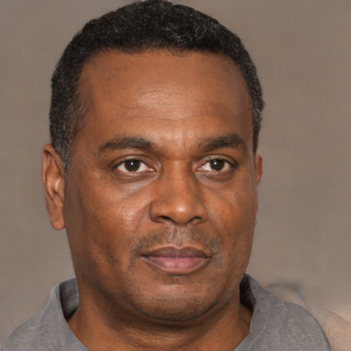 Neutral black adult male with short  brown hair and brown eyes