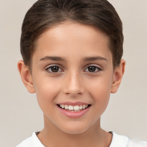 Joyful white child female with short  brown hair and brown eyes