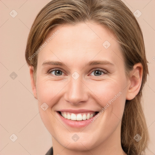 Joyful white young-adult female with medium  brown hair and grey eyes