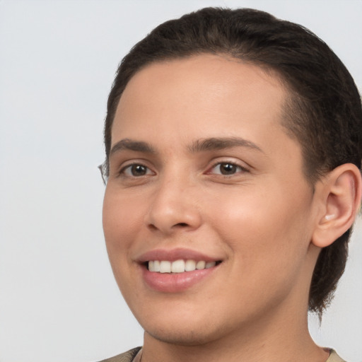 Joyful white young-adult female with short  brown hair and brown eyes