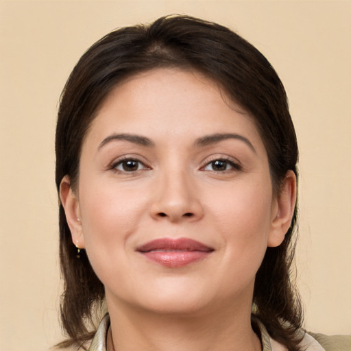 Joyful white young-adult female with medium  brown hair and brown eyes