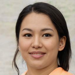 Joyful asian young-adult female with medium  brown hair and brown eyes