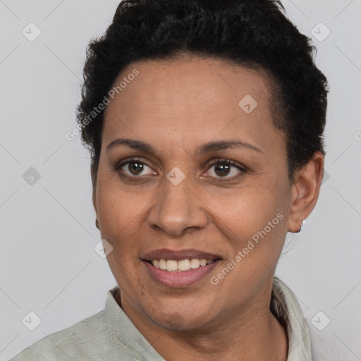 Joyful latino adult female with short  brown hair and brown eyes