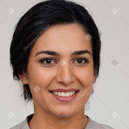 Joyful latino young-adult female with medium  black hair and brown eyes