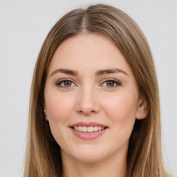 Joyful white young-adult female with long  brown hair and green eyes