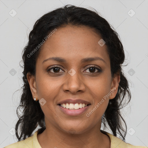 Joyful black young-adult female with medium  brown hair and brown eyes