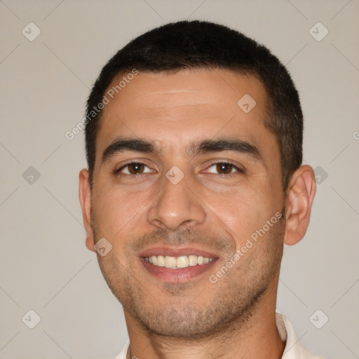 Joyful white young-adult male with short  brown hair and brown eyes