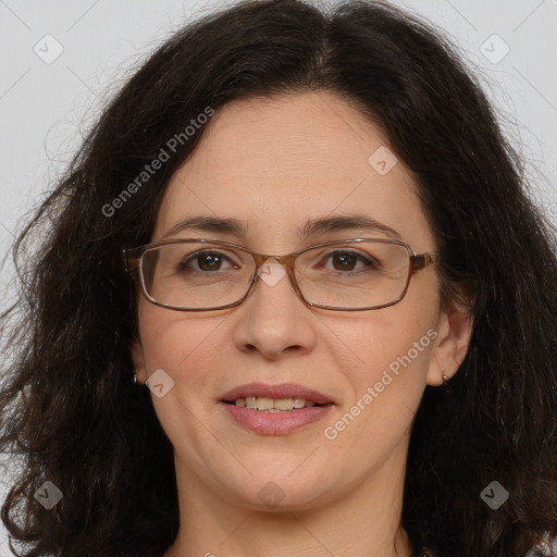 Joyful white adult female with long  brown hair and brown eyes