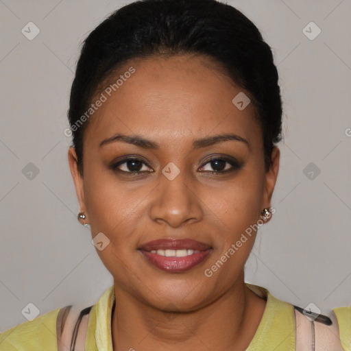 Joyful black young-adult female with short  black hair and brown eyes