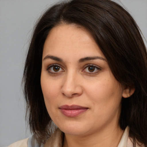 Joyful white young-adult female with medium  brown hair and brown eyes