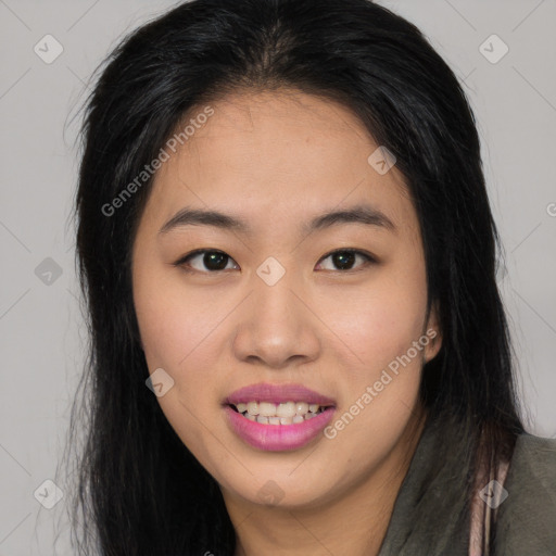 Joyful asian young-adult female with long  brown hair and brown eyes