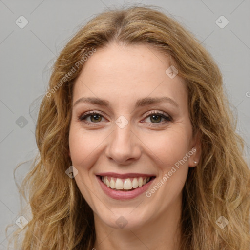 Joyful white young-adult female with long  brown hair and green eyes