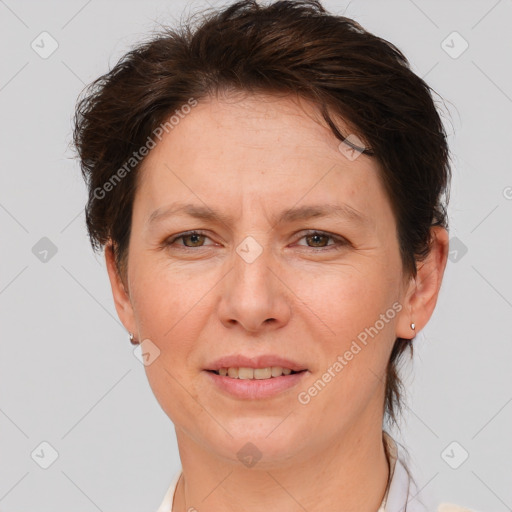 Joyful white adult female with short  brown hair and brown eyes