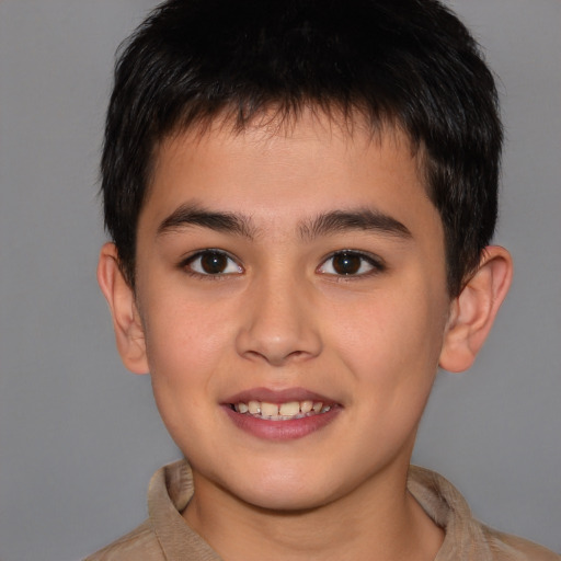 Joyful white child male with short  brown hair and brown eyes