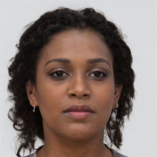 Neutral black young-adult female with long  brown hair and brown eyes