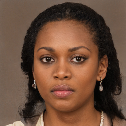 Neutral black young-adult female with long  black hair and brown eyes