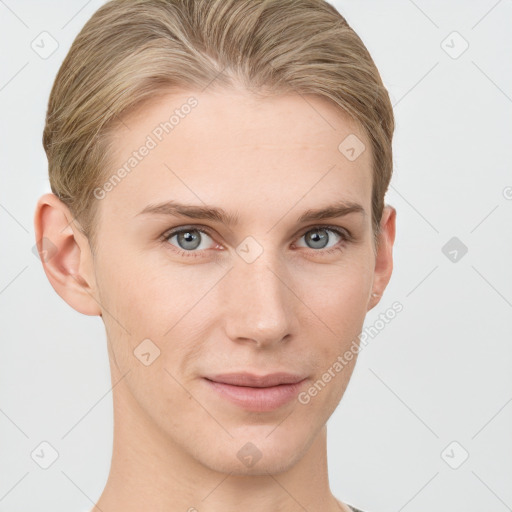 Joyful white young-adult female with short  brown hair and grey eyes